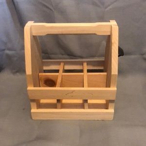 Sturdy solid wood drink carrier. 6 cans or six bottles. Includes bottle opener.